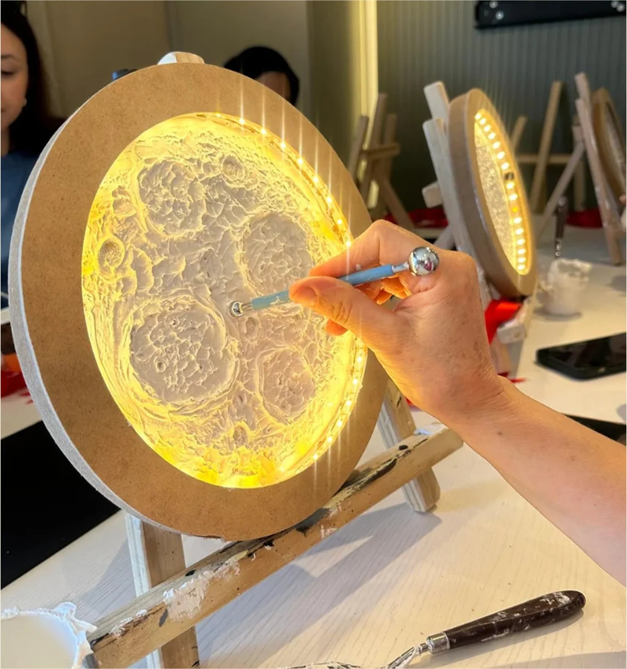 Illuminated textured moon artwork