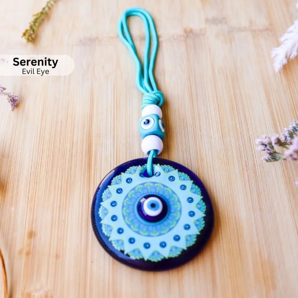 Serenity evil eye with pale blue patterned centre and turquoise hanging cord